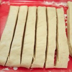 cut dough into 1.5" x 8" strips - photo by: ryan sterritt