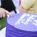 touching the cake - photo by: ryan sterritt