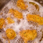 frying squash blossoms - photo by: ryan sterritt